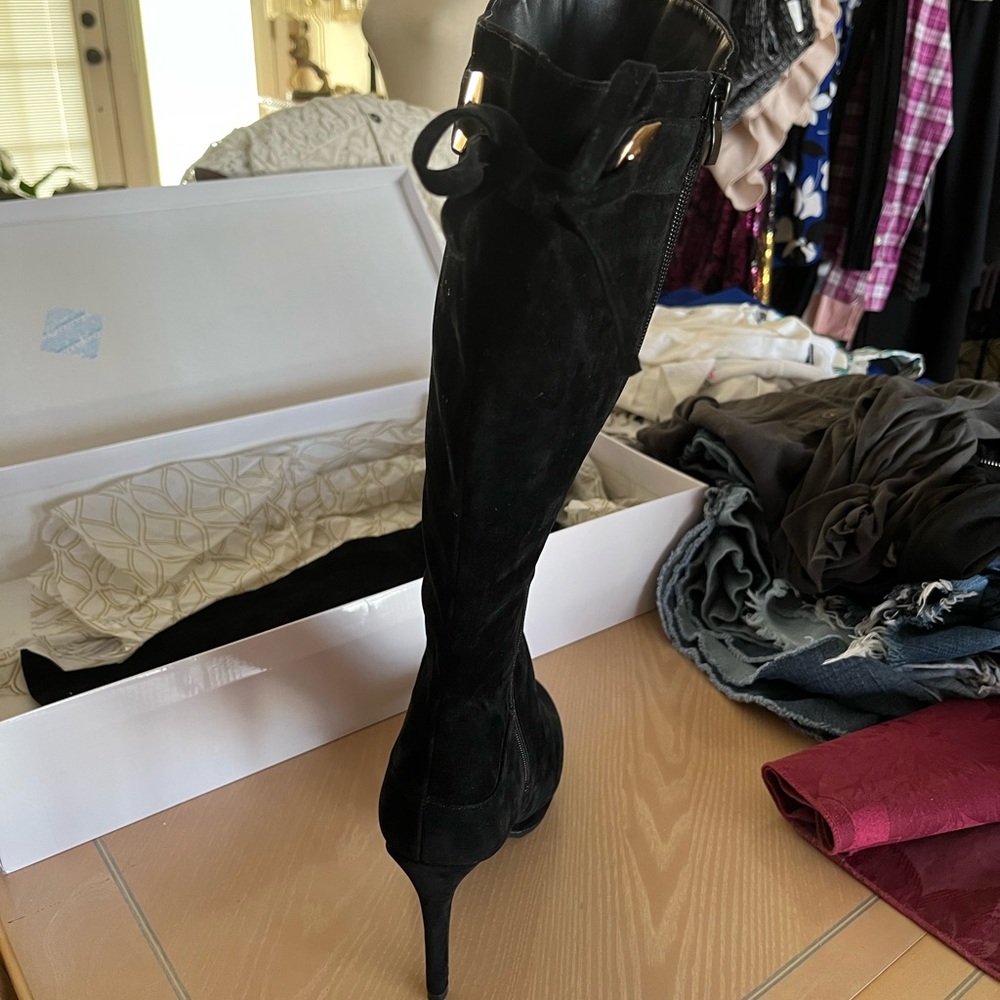 Brand new Womens black knee-high boots.